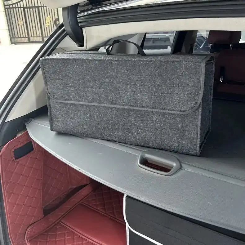 Felt car trunk organizer box sitting on the cargo shelf.