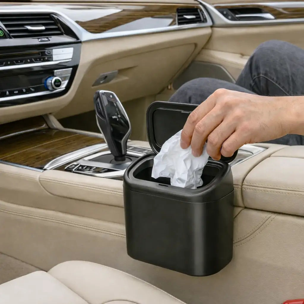 Compact car trash can attached to the center console